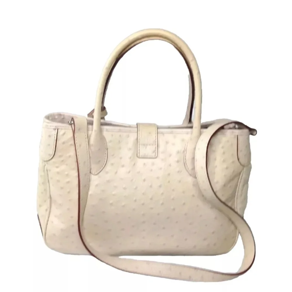 Dooney & Bourke Butter Yellow Ostrich-Embossed Satchel with lilac dots